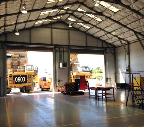 A high pitch roof can be supported by Xtreme Cubes, providing a large, open plan sheltered workshop area for multiple mechanics.