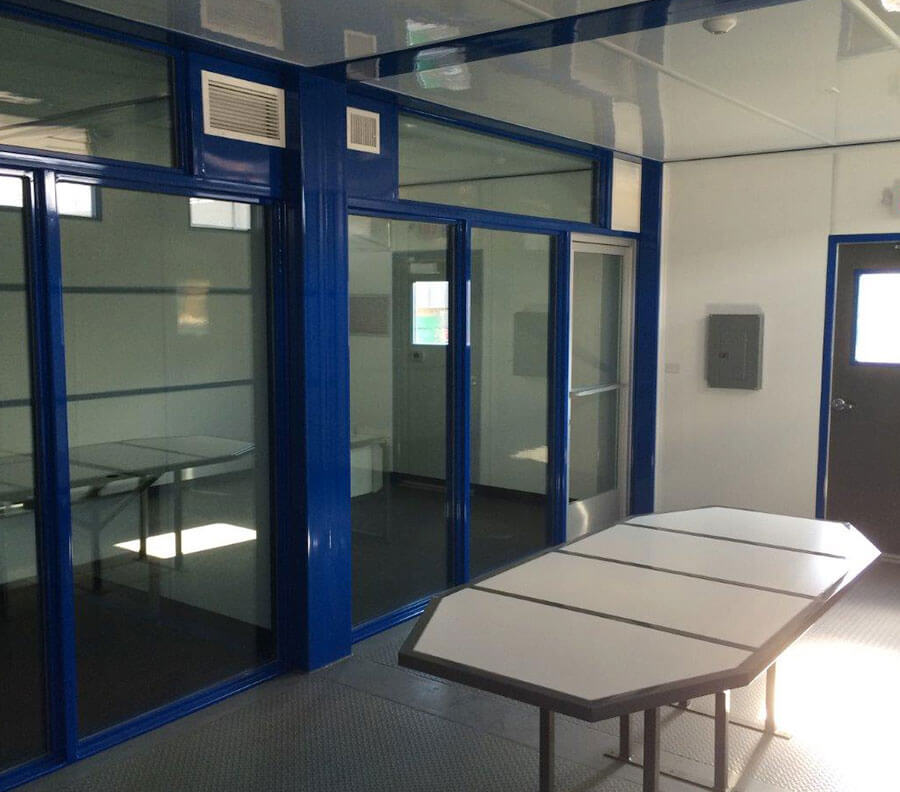 Office furniture, such as conference tables, can be built into the Cubes, eliminating the need to remove furniture when redeploying the Cube office in other locations.