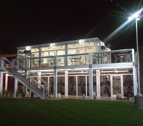 Glass store fronts, upper deck and integrated lighting give a contemporary look to an two-story Xtreme Cube retail facility.