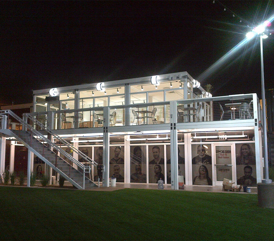 Glass store fronts, upper deck and integrated lighting give a contemporary look to an two-story Xtreme Cube retail facility.