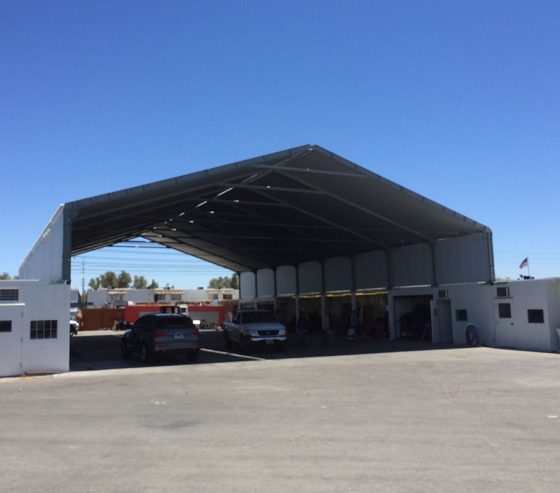The roof provides shelter from weather conditions and creates a dedicated workspace for service and maintenance of equipment and vehicles.