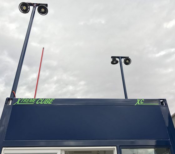 Adjustable light towers provide visibility at night.