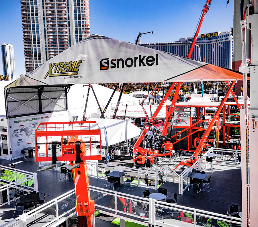The use of a ConTEMProof™ folding roof structure can bring much needed shade to outdoor booths built from Xtreme Cubes.