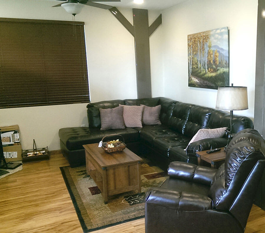 Custom interior with wooden floors and blinds.